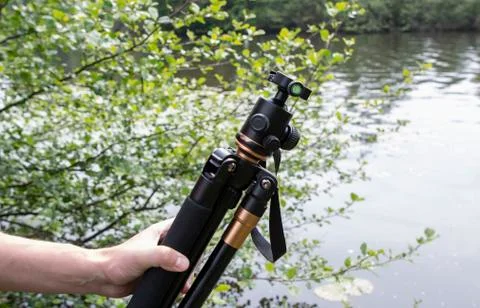 Tripod for a camera with a 3D head in nature Stock Photos