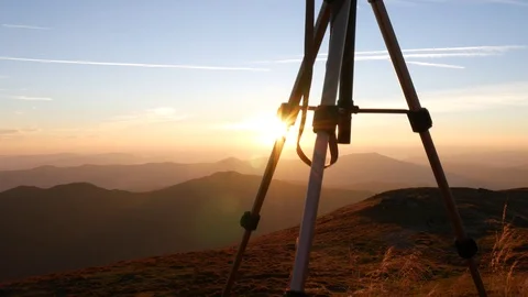 Tripod with camera shooting sunrise on background Stock Footage 95090364