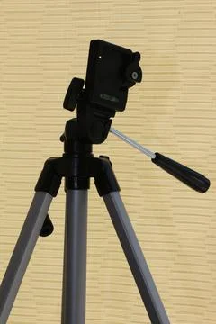 A tripod for a camera. A tripod in the original perspective. Foto stock