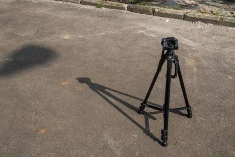 Tripod on the empty road Stock Photos