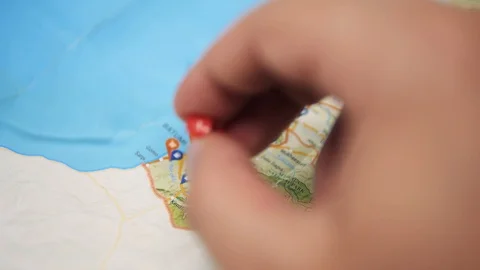 Tripod: Hand pushing a pin on to a paper map of Georgia (country), Batumi Stock-Footage 91977415