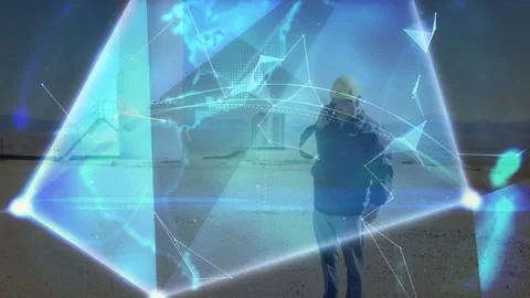 Tripod sensor starting blue nodes forming rotating holo globe as tech on phone Stock Footage 332523069