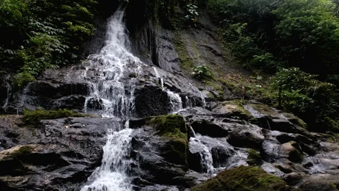 Tripod shot of Goa Giri Campuhan waterfall. Nyanglan, Bali, Indonesia. Stock Footage 285999953
