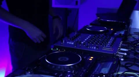 Tripod shot of performing DJ, scratching turntables Stock Footage 20550753