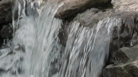 Tripod shot of a small waterfall in a stream shot in slow motion Stock-Footage 132217747