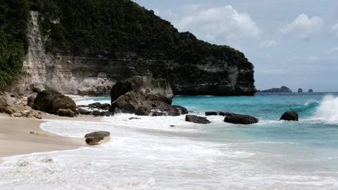 Tripod shot of a surf on Suwehan beach on sunny day. Nusa Penida, Indonesia. Stock Footage 285995281