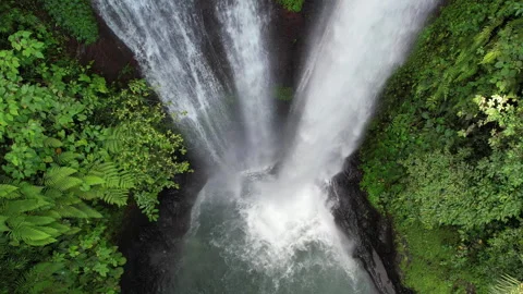 Tripod top view drone slowmo shot of Aling Aling waterfall. Bali, Indonesia. Stock Footage 285993508