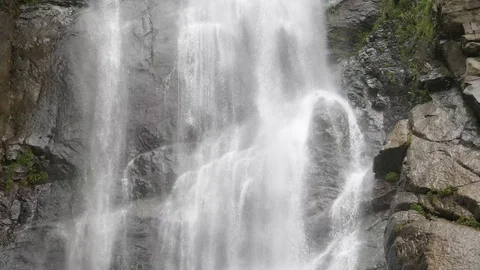 Tripod: Waterfall pouring down the rocks close up 4K Stock Footage 87912833