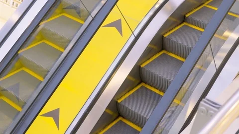 Tripod: Yellow escalator Stock Footage 100124744