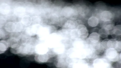 Trippy slow motion out of focus water bokeh light blobs calming water light Stock Footage 107051564
