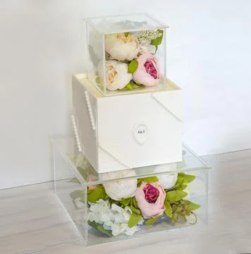 Triumph wedding cake with square cube glass construction Stock Photos