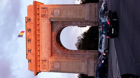 Triumphal arch and flag at sunset red light and purple sky Stock Footage 112873326