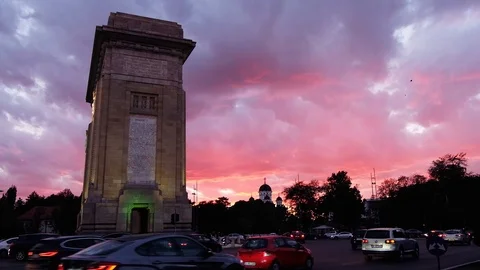 Triumphal arch and flag at sunset red light and purple sky Stock Footage 112873774