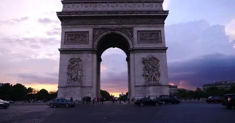 Triumphal Arch in Chaps Elysees , Paris, France. Dramatic sky at sunset. Stock Footage 240840024