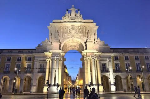 The triumphal arch in the Commerce square (Praca do Comercio), Lisbon, Portug Stock Photos