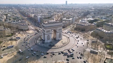 Triumphal arch or Arc de Triomphe and car traffic on roundabout with Tour Stock Footage 280240535