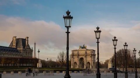 Triumphal arch on the square of Carrousel at sunset in cloudy weather, Paris Stock Footage 76402995