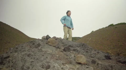 Triumphant hiker at the top Stock Footage 59510874