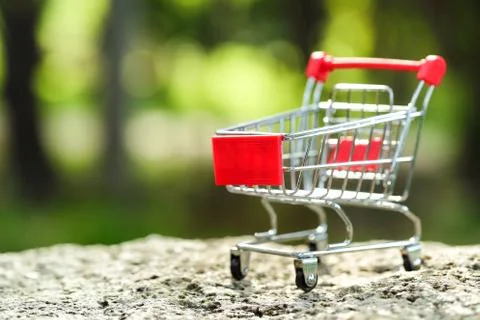Trolley with green background idea for shopping Stock Photos