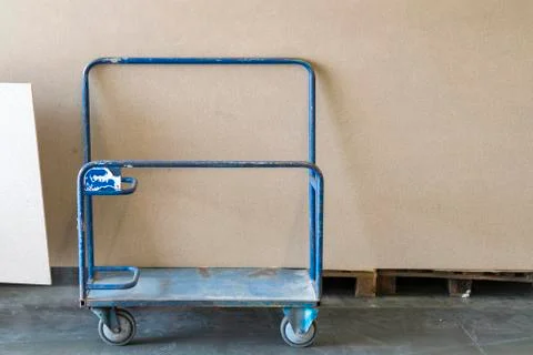 Trolley in a hardware store with building materials. Warehouse large storage Stock Photos