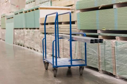 Trolley in a hardware store loaded with construction materials. Repair and co Stock Photos