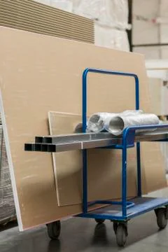 Trolley in a hardware store loaded with construction materials. Repair and co Foto stock