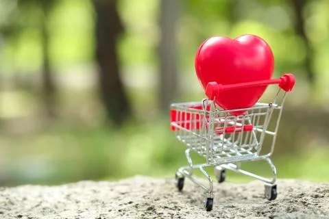 Trolley with heart, idea for shopping using as business background Stock Photos