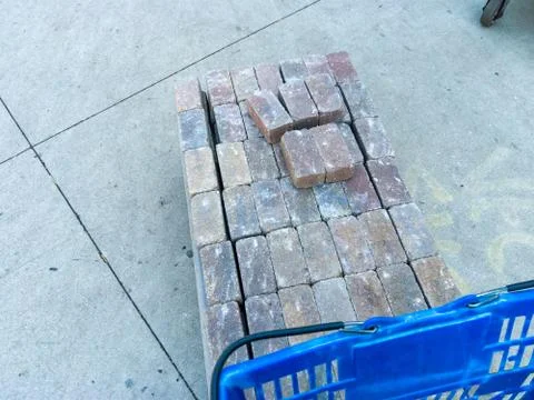 Trolley loaded with stacked bricks at a store Stock Photos