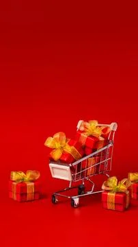 Trolley with red gift boxes, vertical banner Fotos Stock