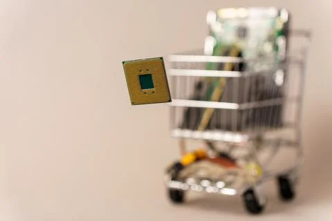 Trolley from supermarket filled with computer components. ?pu in front. Selec Stock Photos