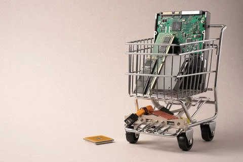 Trolley from supermarket filled with computer components. Stock Photos