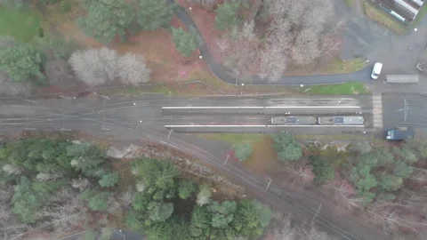 Trolley Train Standing Still, Train Stop in Rural Area, Top Down Sideways Aerial Stock-Footage 147615313