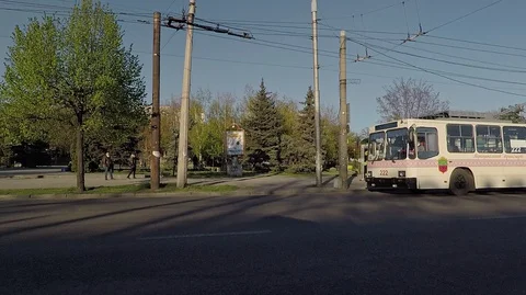 Trolleybus pulls away from the stop, passengers in a mask, quarantine Stock Footage 128352810