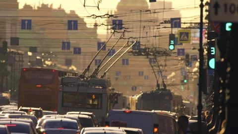 Trolleybuses move slowly in a dense traffic on Nevsky Prospect on hot Sunday 스톡 동영상 146979158