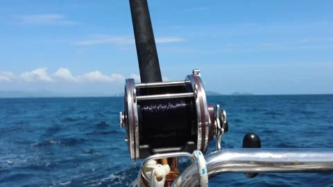 Trolling rod reel, fish caught on a hook, trolling fishing in the sea Stockbeeldmateriaal 280076433