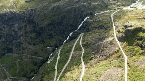 Trollstigen or Trolls Path is a serpentine mountain road in Norway 動画素材 115210945