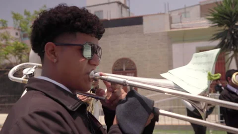 Trombone player perform for the Señor de los Milagros, Lima, Peru Video stock 320375571