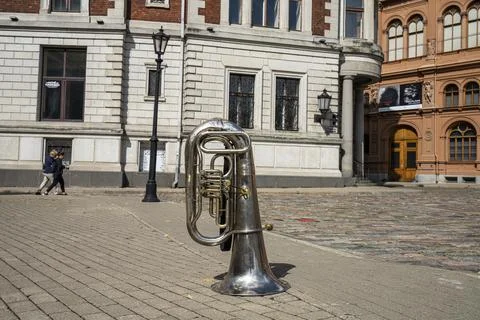 A trombone on the sidewalk Photos