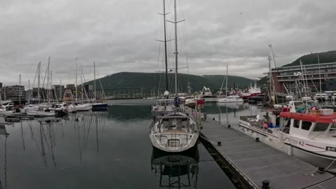 Tromso harbor marina floating dock with sailboat and mountain background Norway Vidéo 341697374