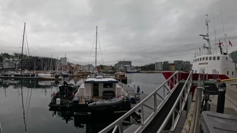 Tromso harbor pier with docked expedition vessel and yachts in marina Norway Vídeos de archivo 341697368