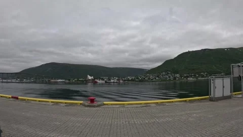 Tromso harbor pier view of Arctic Cathedral and Storsteinen mountain over fjord Vídeo Stock 341697347