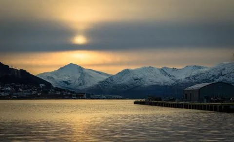 Tromso mountains clouds light and sun Troms County, northern Norway Stock Photos