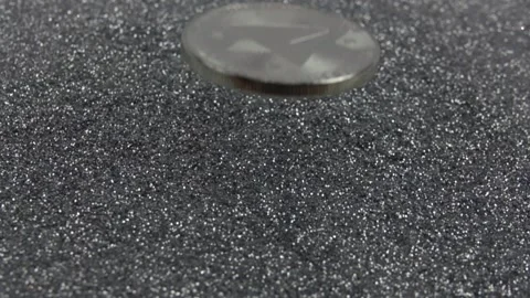 TRON cryptocurrency falls on silver sequins. Stock Footage 155544147