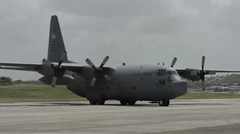 Troops arrive on C-130 Hercules transport aircraft Stock Footage 39329816