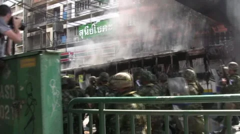 TROOPS AVANCE IN CITY STREET Forward Move Confront Protesters Rioters Bangkok Stock Footage 1089322