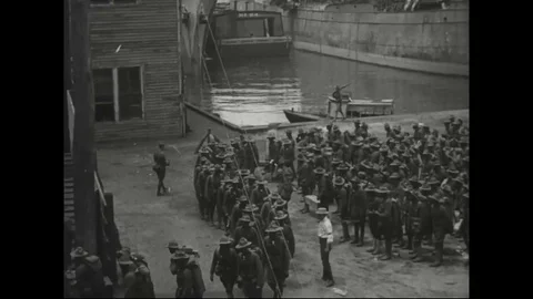 Troops marching towards ship at Newport News harbor, Virginia - 1918 Stock Footage 83660476