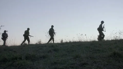 Troops on patrol outside, World War II, 1940s - Reenactment Stock Footage 202535761