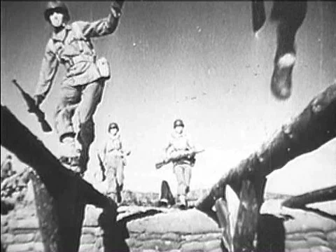 Troops train for D-Day, pushing through an obstacle course, invading beachesƒ Stock Footage 75769931