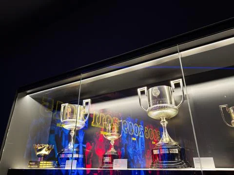 Trophy display case with silver cups and awards in Barcelona, Spain museum .. Stock Photos