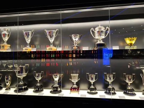 Trophy display of silver cups and awards in a sports museum showcase at FC .. Stock Photos
